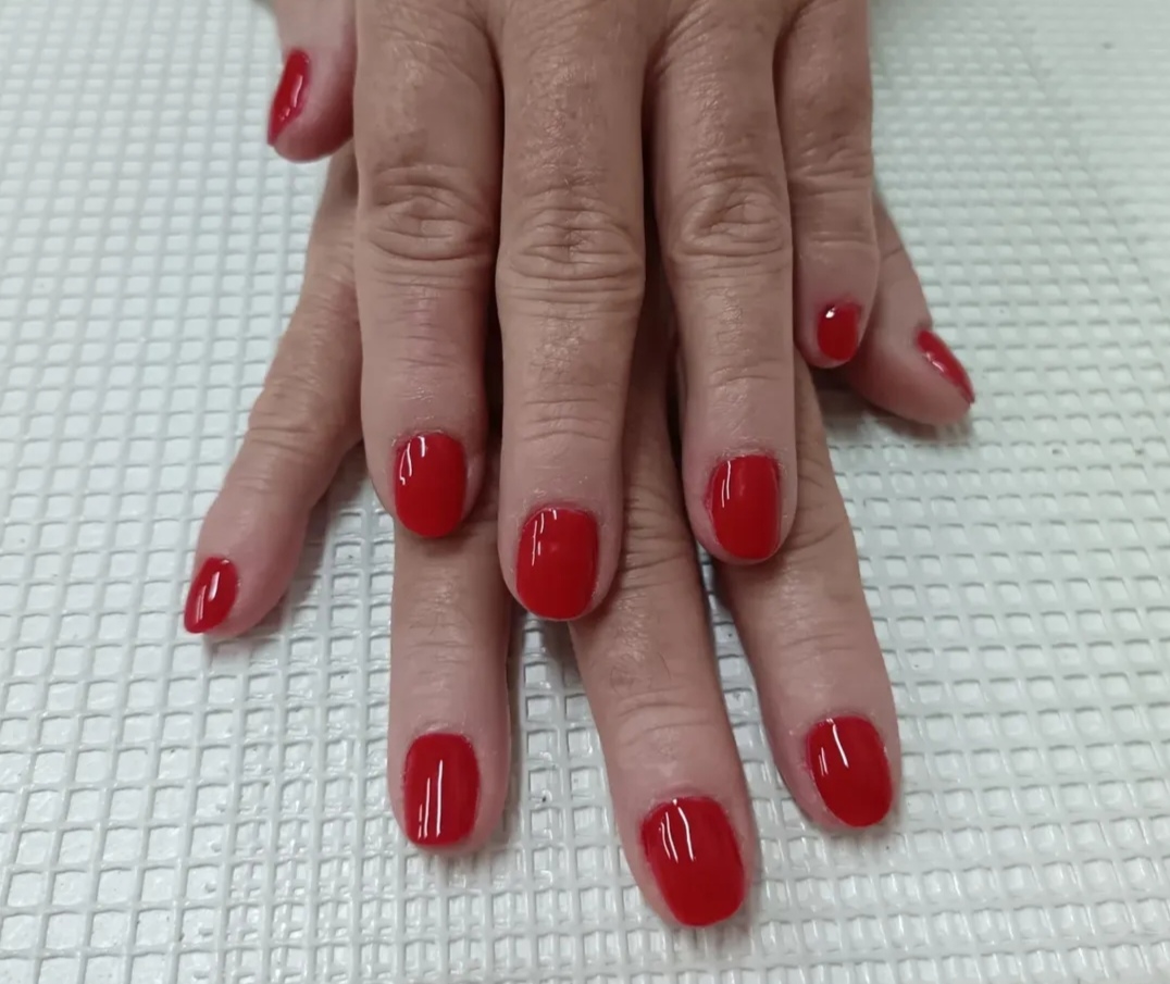 Glossy red gel nails