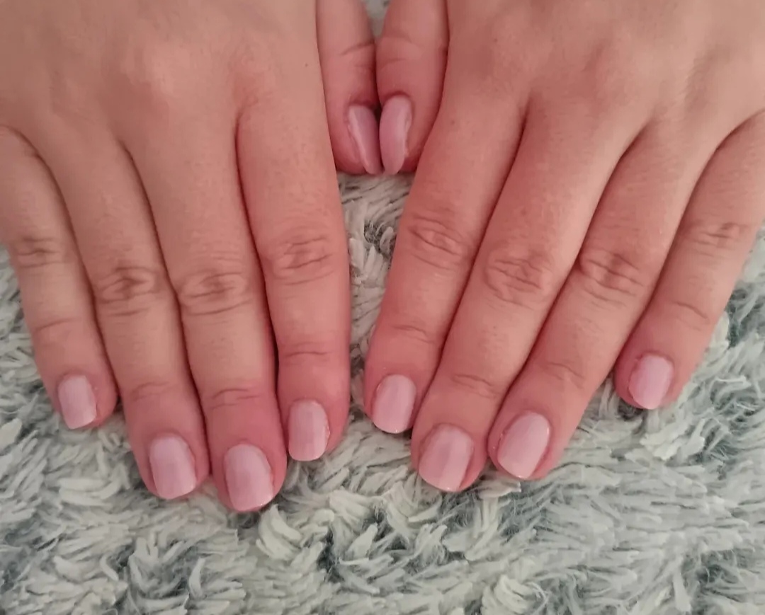 Natural soft pink manicure on both hands